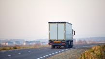 semi-truck-with-cargo-trailer-driving-on-highway-h-2024-12-06-04-07-12-utc