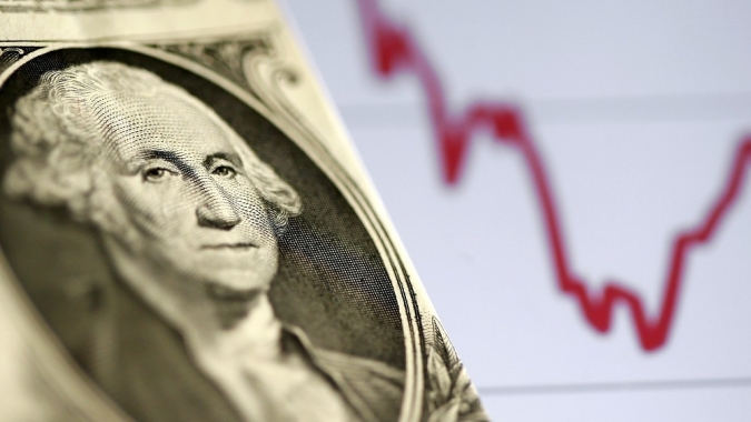Dólar sobe, mas se afasta de máximas com dados econômicos locais