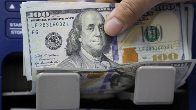 Dólar tem pouca alteração ante real com Orçamento em foco
